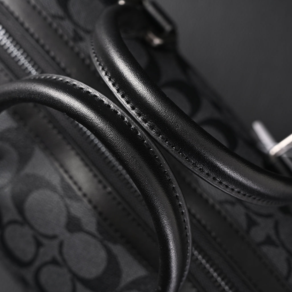 Coach Signature Duffel Bag – Black Monogram Canvas with Leather Trim